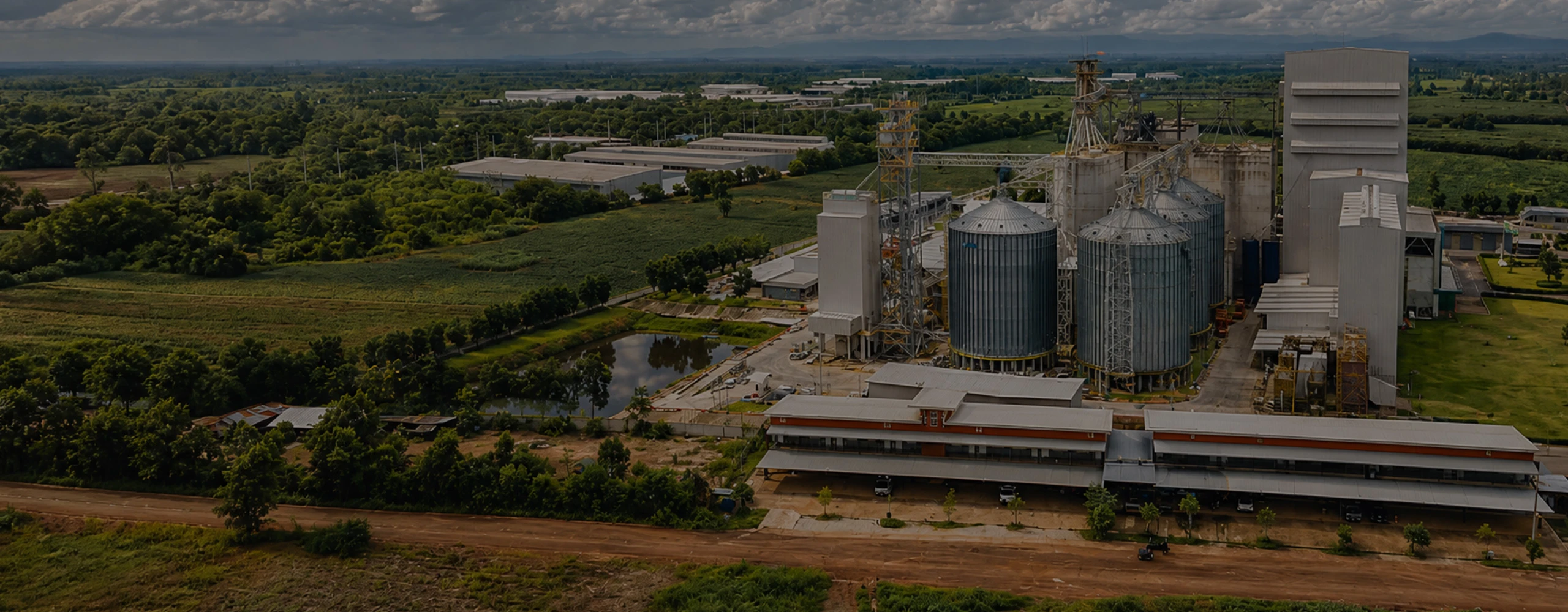 Aerial view of complete livestock feed pellet production line plant with silos for animal feed manufacturing